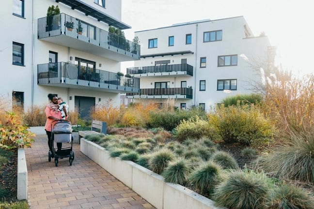 person with stroller and baby eqTEEBA.width .jpg
