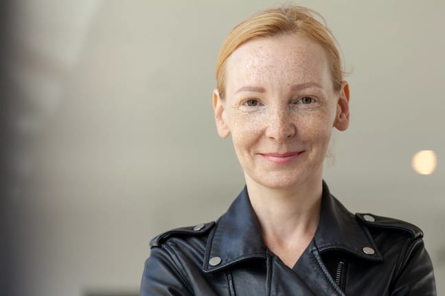 getty smiling looking at camera black shirt.jpg