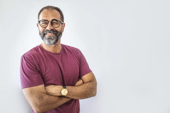 getty smiling person in pink tshirt beard.jpg