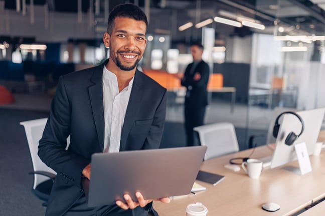 man s smiling professional laptop gettyimages .jpg