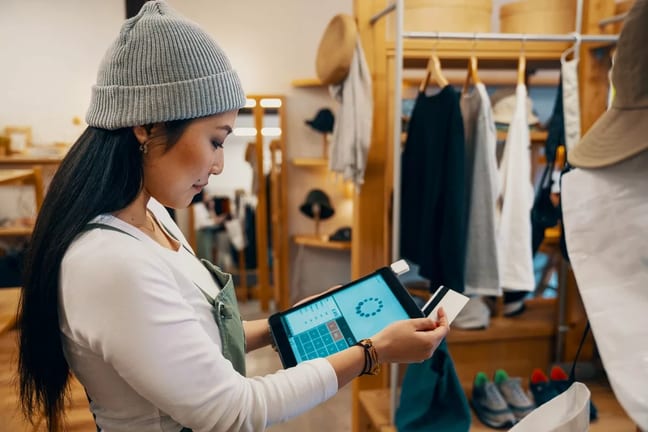 store clerk swiping credit card.width .jpg