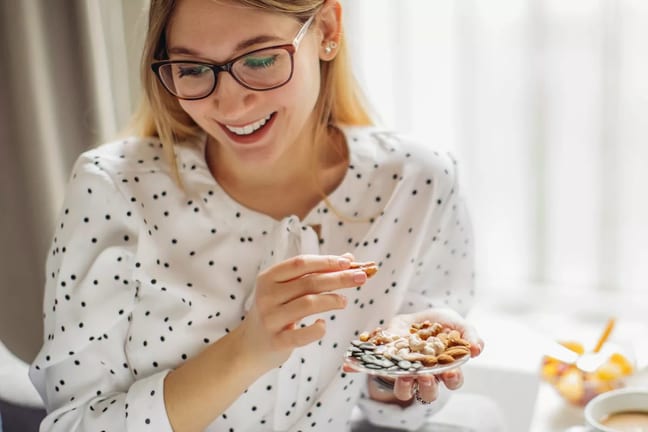 Person munching on some snacks they hold in t.width .jpg