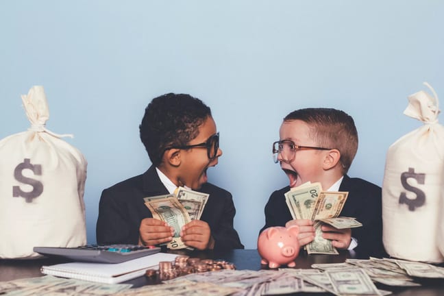 getty children kids amazed money getting rich get rich dollars.jpg