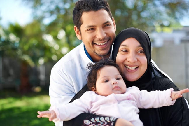 getty smiling happy family with child.jpg