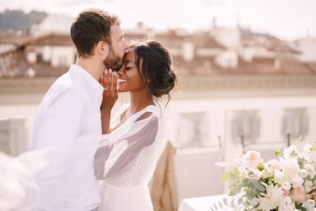 newlywed wedding couple bride groom kiss happy veil wedding dress x aae.jpg