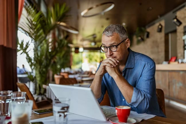 stressed man in cafe ZjhDgAI.width .jpg