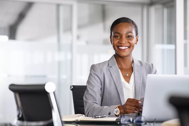 woman s smiling desk gettyimages .jpg