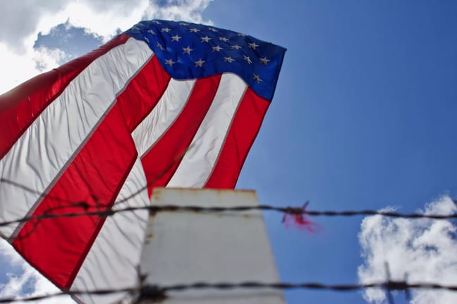 immigration barbed wire fence american flag us worker getty.jpg