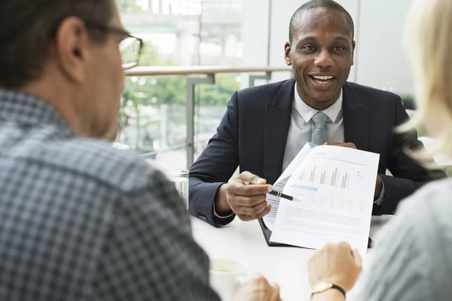 mature couple talking to financial advisor PO.width CEYgc.jpg