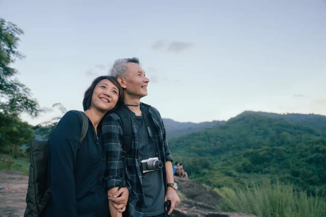 smiling senior couple out hiking.jpg