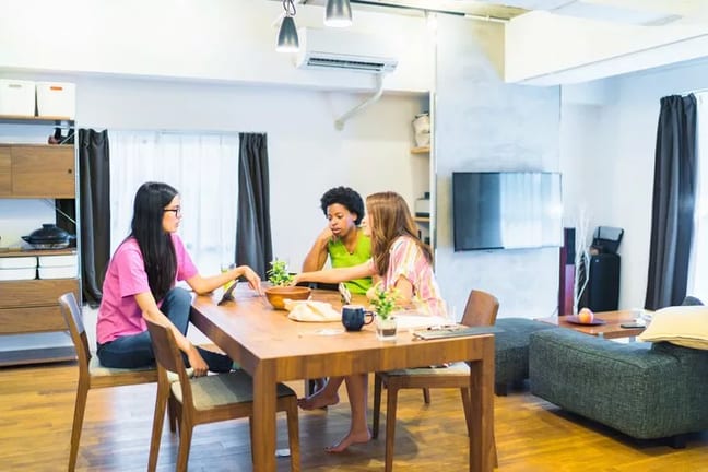 three female roommates in apartment.width .jpg