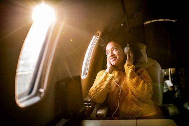 Airplane passenger listening to music olkY.width .jpg