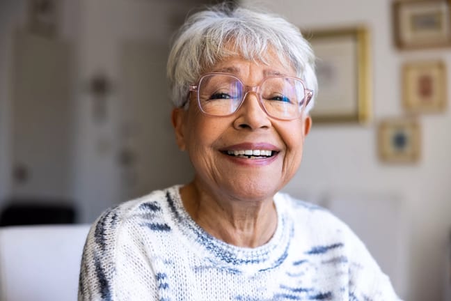 getty happy smiling in light colored top.jpg