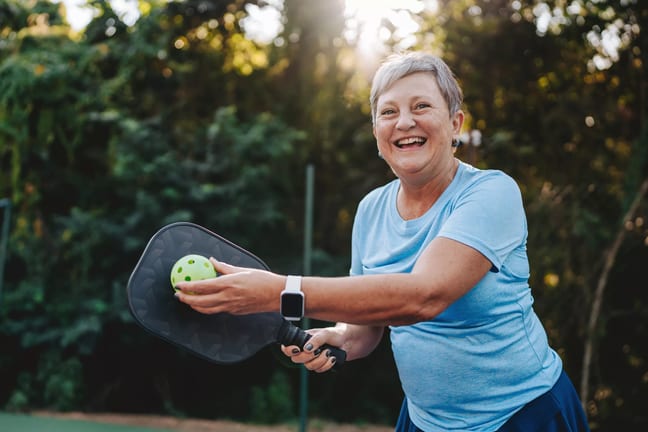 getty happy smiling pickleball player exercise fitness sports.jpg