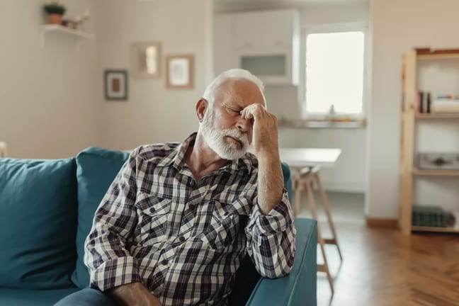 older man couch headache gettyimages .jpg