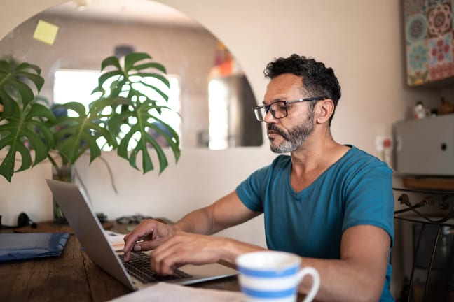 person using a laptop at home.jpg