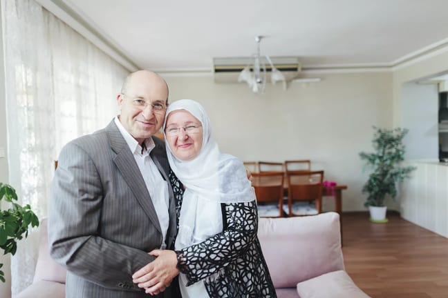 getty smiling couple on couch.jpg