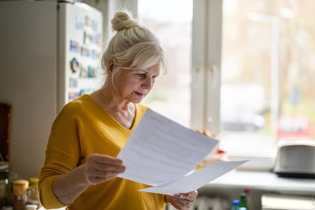 senior looking at documents.jpg