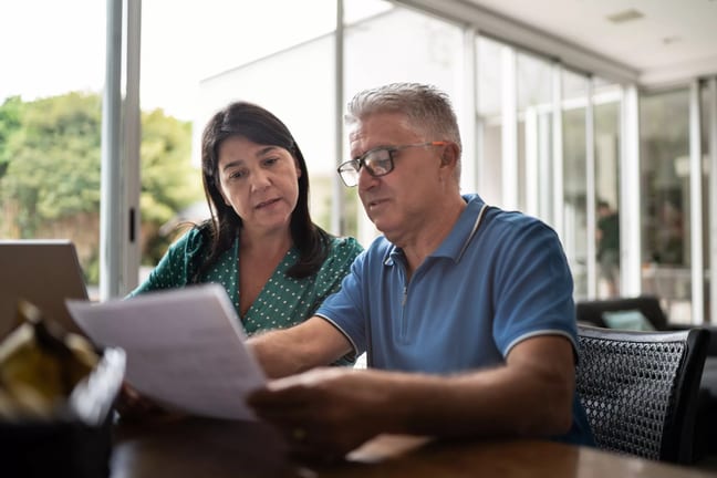 middle aged couple looking at document.jpg