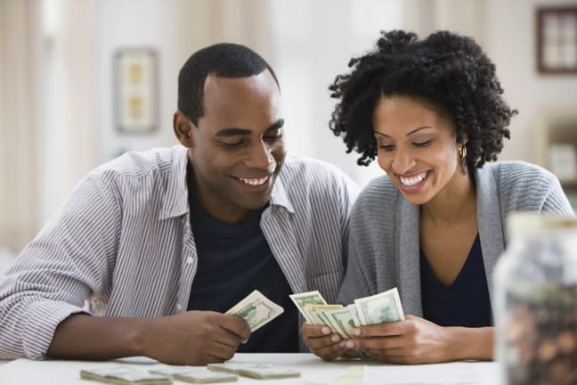 smiling couple counting money.jpg