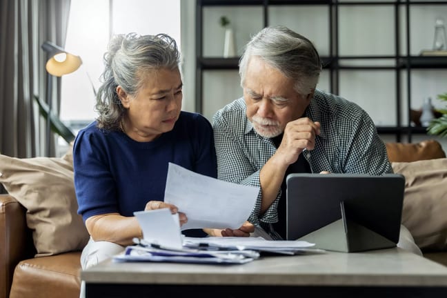 serious couple looking at documents together.jpg