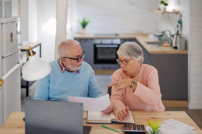 senior couple at a desk serious gettyimages .jpg