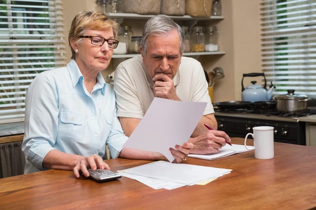 senior couple documents worried gettyimages .jpg