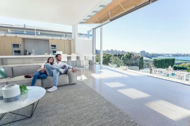 couple on couch in nice house FNNZDZQ.width .jpg