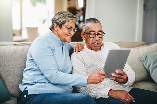 senior couple using a digital tablet at home.jpg