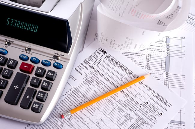 gettyimages adding machine taxes