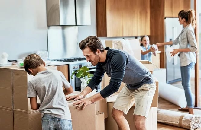 parents and kids packing moving boxes.width .jpg