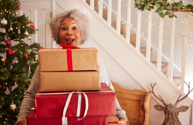 Woman holding gifts LYQJxI.width .jpg