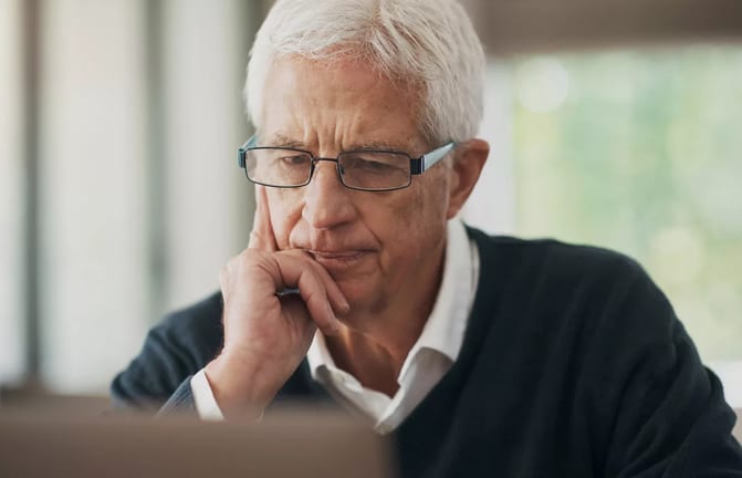 serious man staring intently at laptop.jpg
