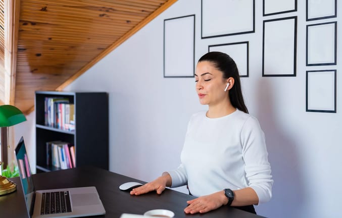 woman s eyed closed at desk calm gettyimages .jpg