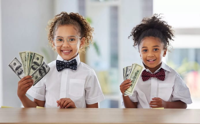 kids holding american currency.jpg