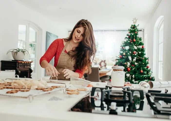 woman baking holiday cookies.width .jpg