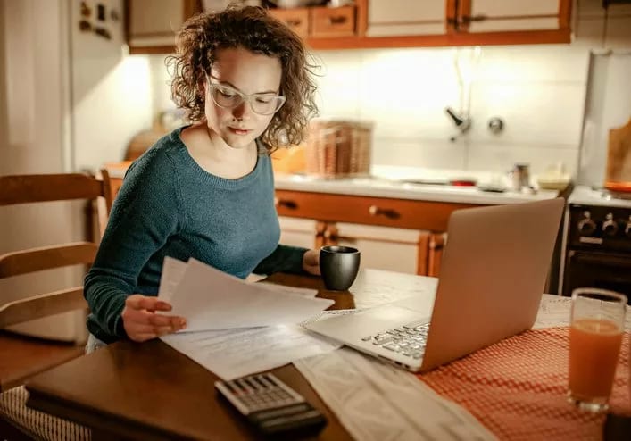 woman with bills and computer.width .jpg
