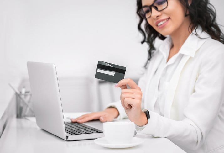 smiling woman with credit card.width .jpg