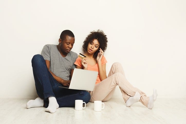couple with laptop and credit card ZBP.width