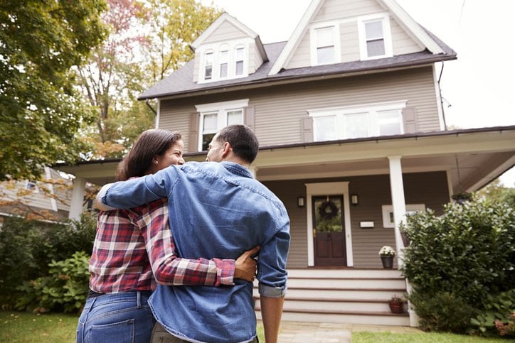 couple in front of new house.width .jpg