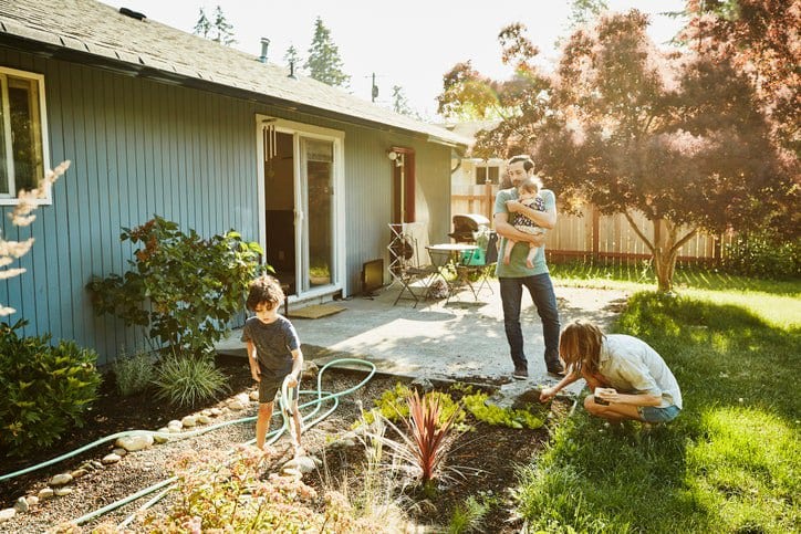 family in backyard garden PRMOWmx.width .jpg