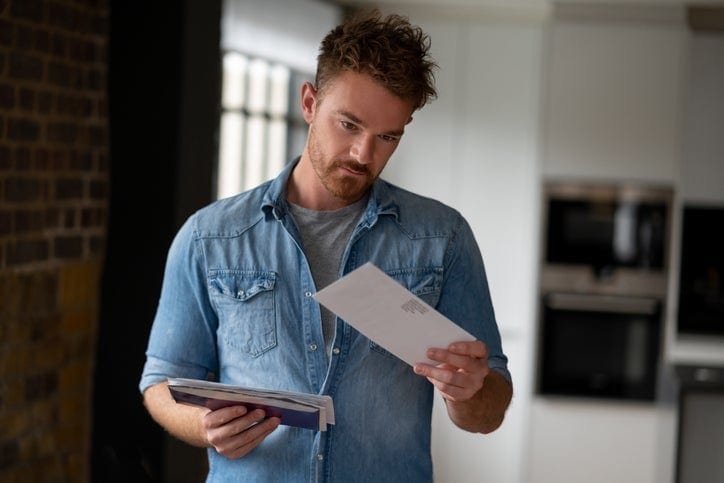 man opening mail envelopes iBuuR.width .jpg