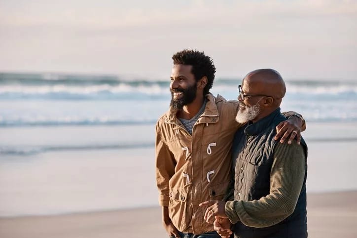 man with father on beach FEHtyJ.width .jpg