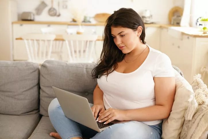 woman on couch with laptop.width .jpg