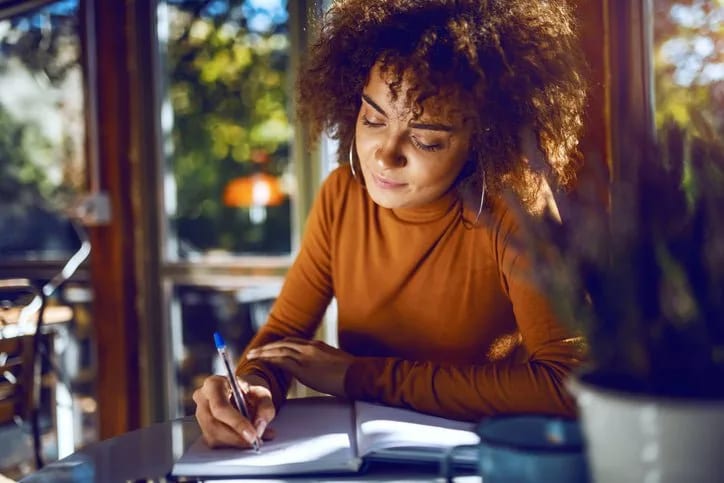 woman writing in notebook BQggFYa.width .jpg