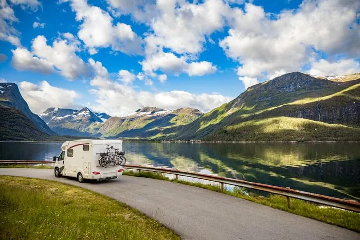 rv driving past mountain lake.width KAplCV.jpg