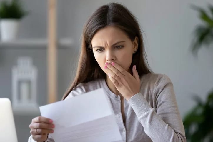 woman surprised at bill.width HBTG.jpg