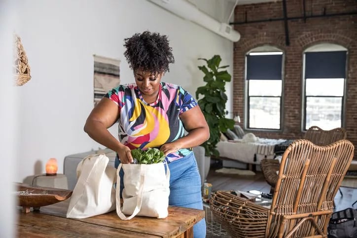 woman unpacking grocery bags.width .jpg