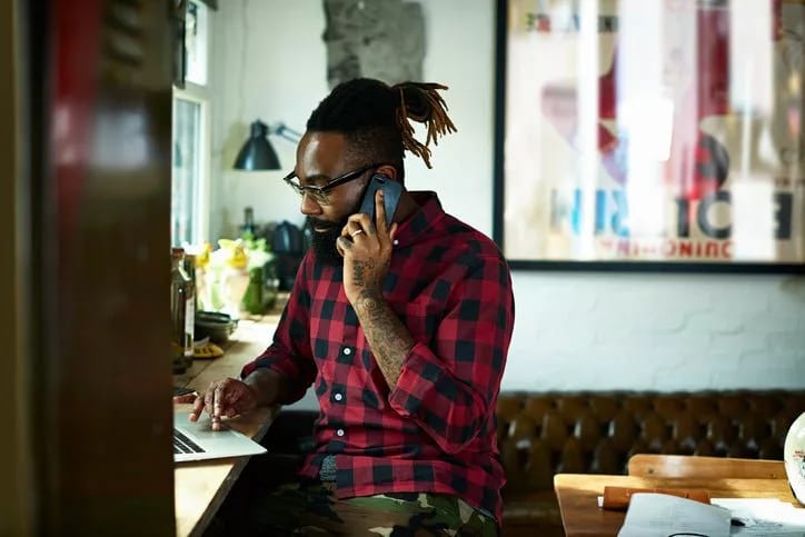 man on phone call and laptop XoCgMIF.width .jpg