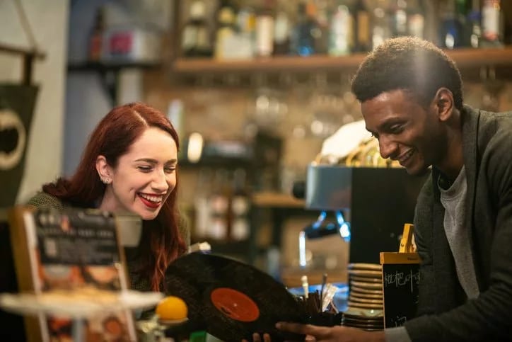 man and woman shopping record store CgcaUNo.width .jpg